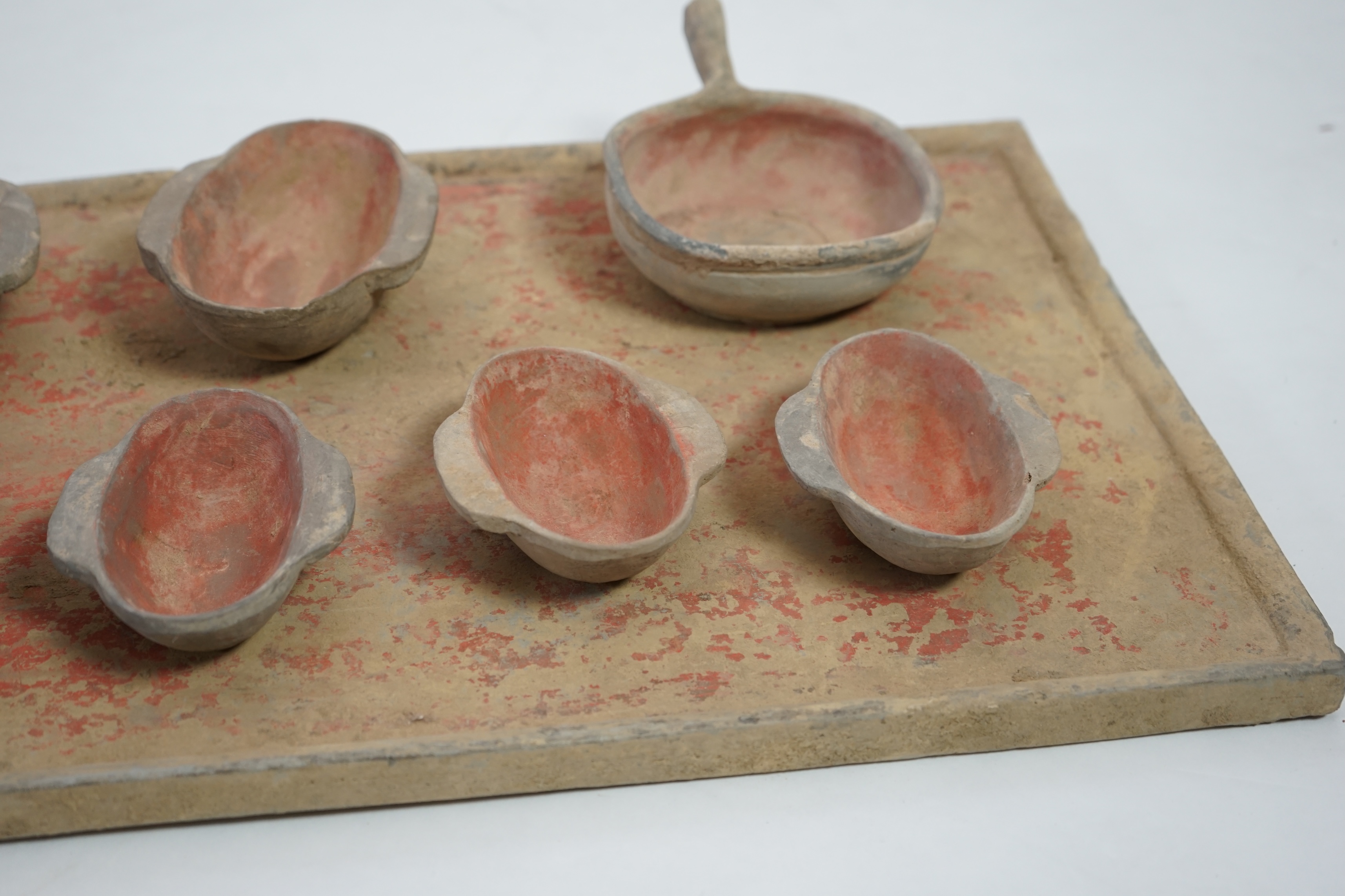 A large Chinese painted pottery tray, ladle and cups set, Han dynasty (206 BC-AD 220)